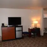 a hotel room with a LED TV on the table
