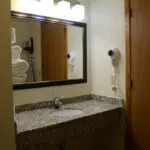 a king bathroom sink with a mirror